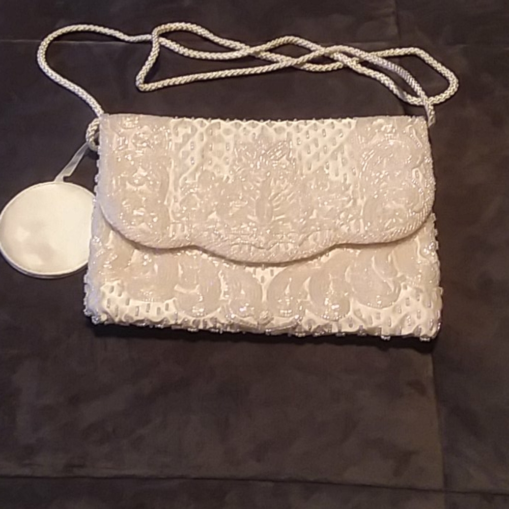 Off white beaded clutch